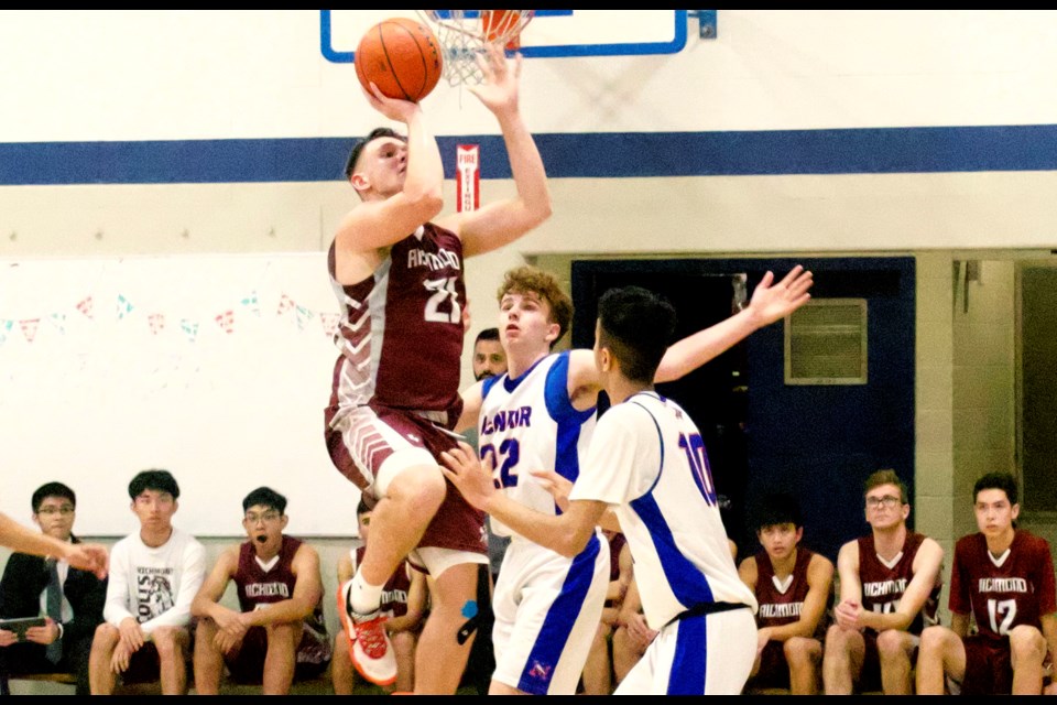 Arminas Ilciukas goes up for two of his 26 second half points to lead the Richmond Colts past the McNair Marlins in Richmond Senior Boys Basketball League action.