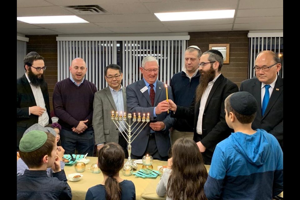 Michael Sachs(third right), the past-president of Richmond’s Bayit Synagogue, said the best way to combat hatred is love. Photo submitted