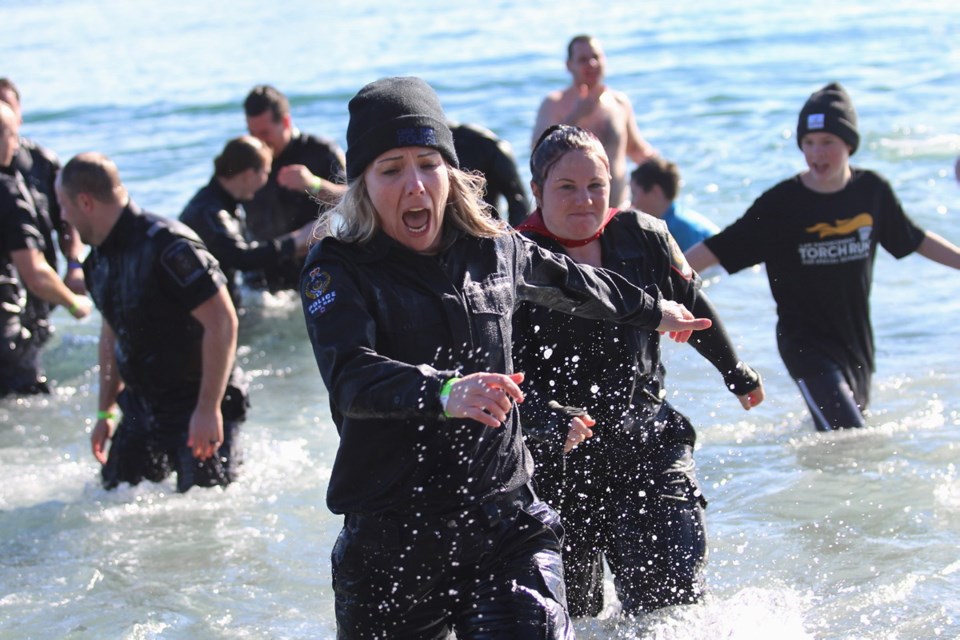 Law-enforcement members joined Special Olympics athletes and other fearless participants at last year's Vancouver Island Polar Plunge at Willows Beach. This year's event takes place next Sunday.