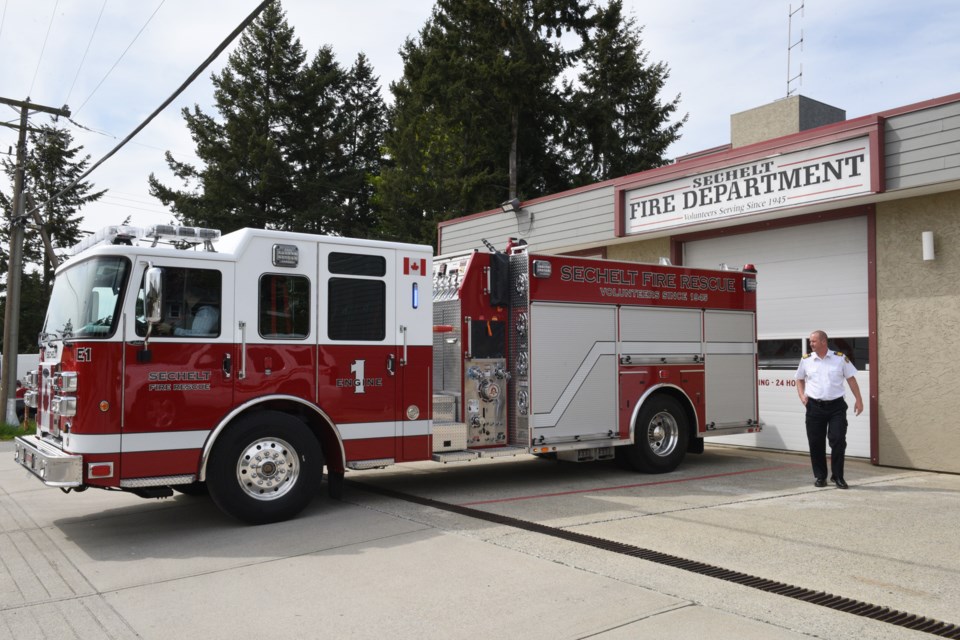 Fire Chief Trevor Pike next to the newly delivered Fire Engine No.1 at the Sechelt Fire Department.