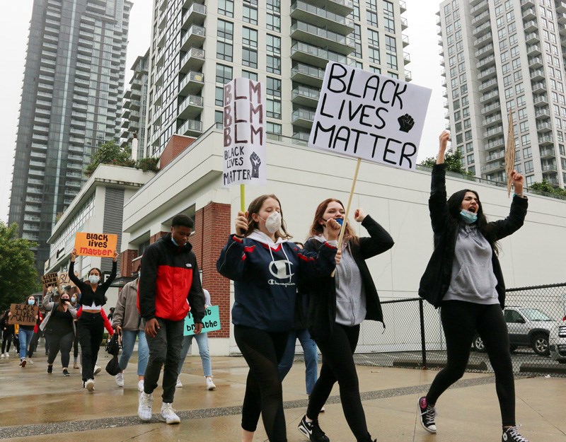 Protestors march in the Tri-Cities June 9 against police brutality and in support of an end to insti