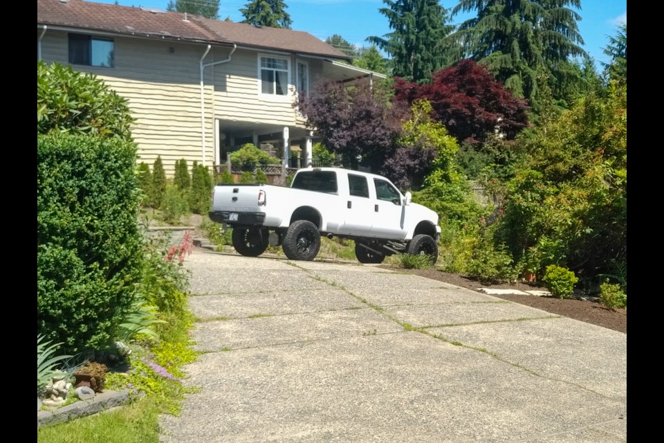 A visitor to the Coquitlam Crunch parks in a nearby resident's driveway. Residents of Lansdowne Drive say traffic, U-turns and illegal parking have gotten out of control this year, with one resident saying two of his kids were nearly hit by an irate driver whipping a U-turn in their driveway.