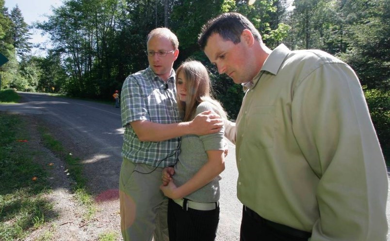 May 17, 2006: Ray Wightman, left, and Glen OKeefe with Adriana Kelly in the area on Triangle Mountain where they and friend Chris Johnson found an infant Kelly abandoned in a ditch. DEBRA BRASH, TIMES COLONIST