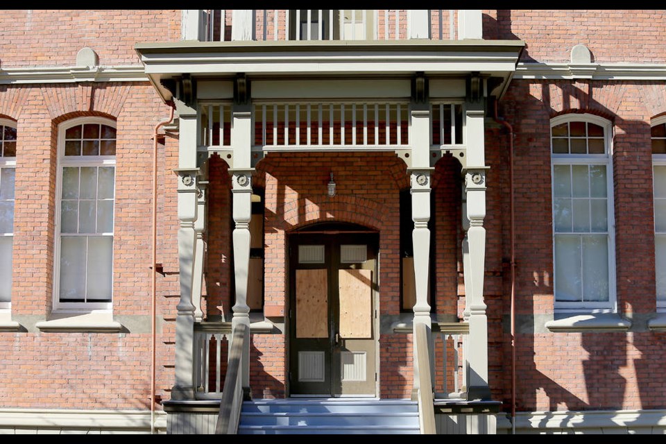 Doors of South Park Elementary School are boarded up after windows were broken. ADRIAN LAM, TIMES COLONIST