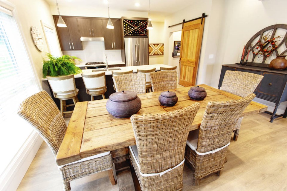 Jill calls her decorating style shabby chic and incorporates lots of natural elements, such as these pottery bowls on the dining room table and sideboard. DARREN STONE, TIMES COLONIST