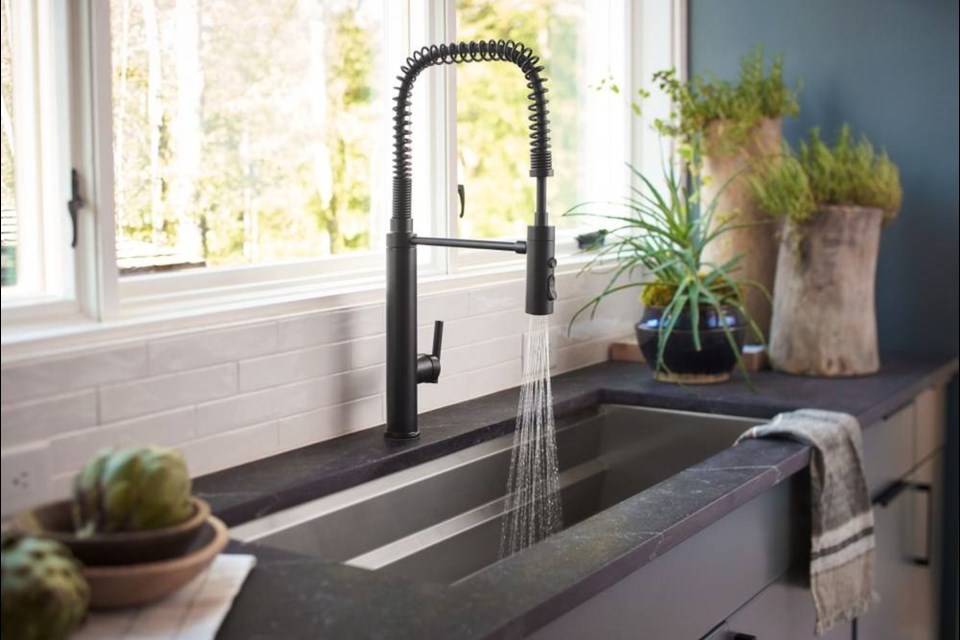 A well-designed kitchen sink and arched faucet are perfect complements for the ardent chef.