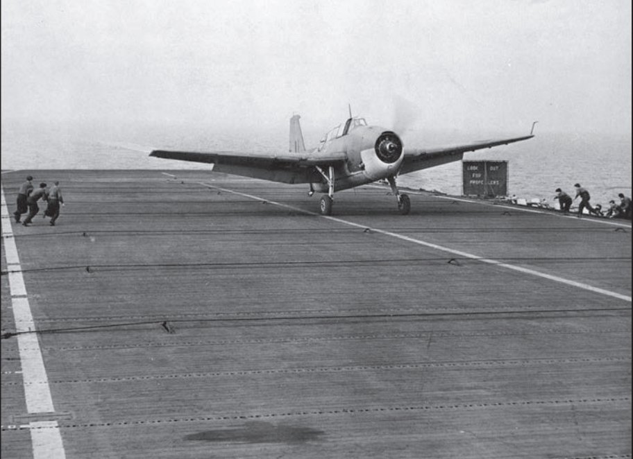 An Avenger torpedo bomber lands on the deck of the H.M.S. Nabob