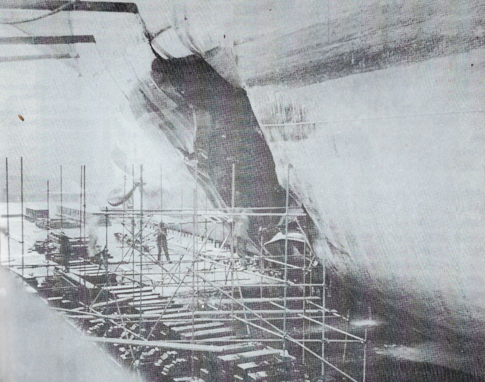 A gaping 32-foot wide hole was blown through the hull of the H.M.S. Nabob by a German submarine Aug.