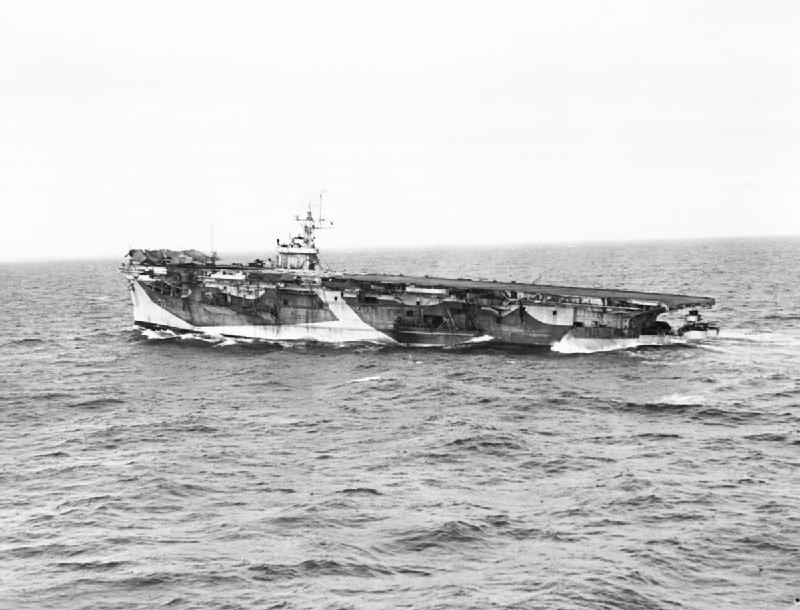 The damaged HMS NABOB proceeding homewards under her own steam, her stern low down in the water. She