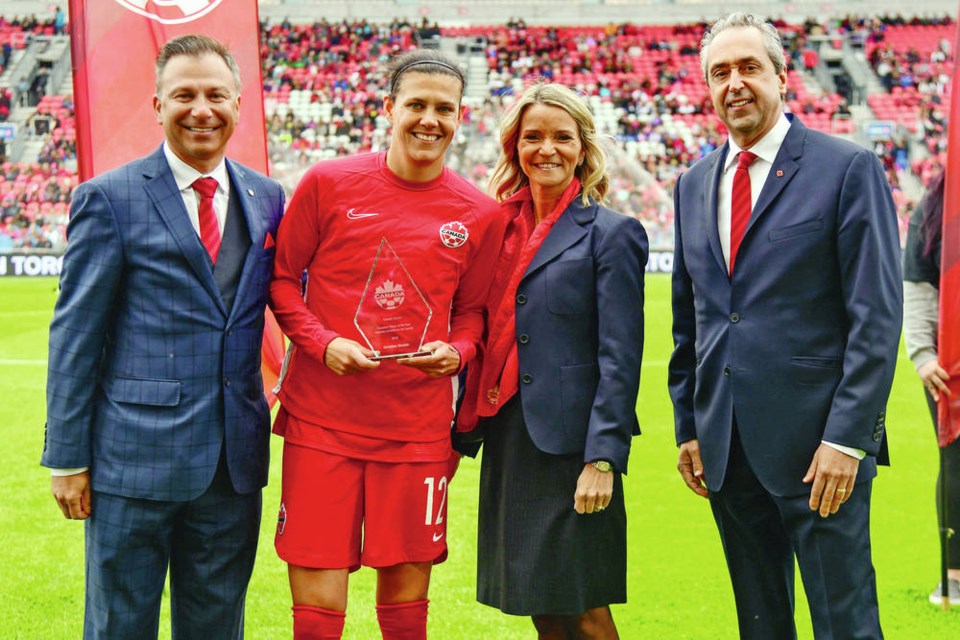 Dr. Nick Bontis, left, newly elected saʴý Soccer president, with Canadian Player of the Year Christine Sinclair, Leanne Nicolle and Peter Montopoli at the Womens International Friendly in May 2019 in Toronto. CANADA SOCCER