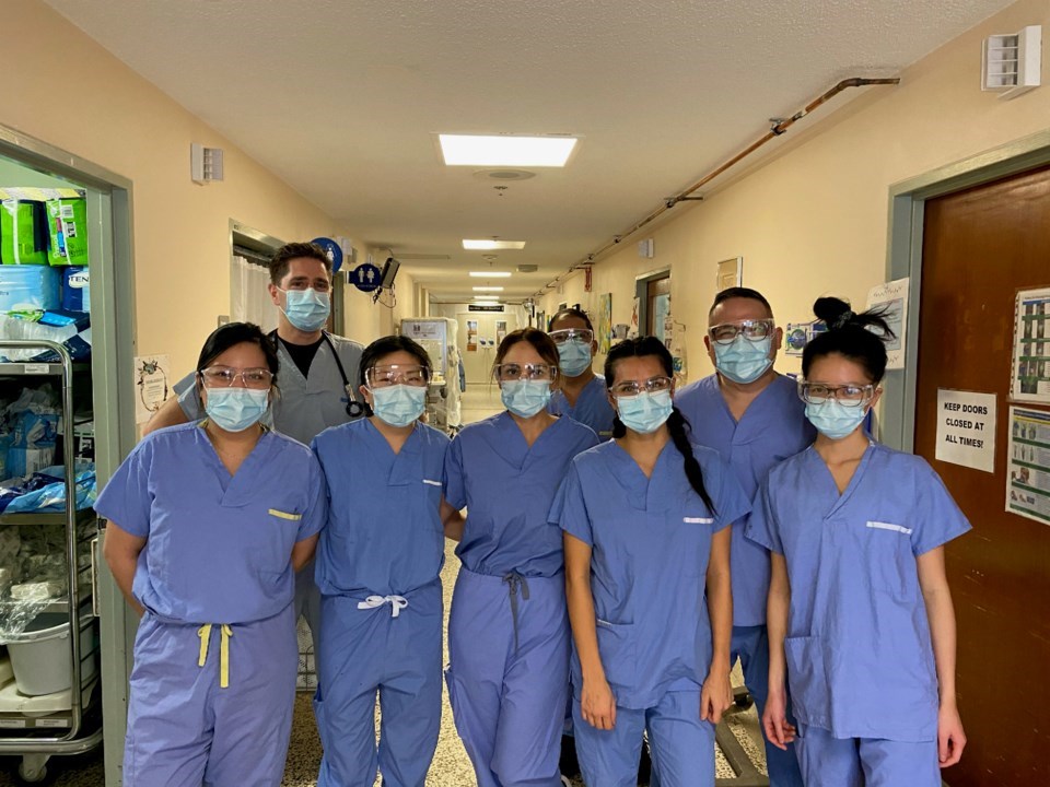 Dr. Kevin McLeod (back left) and nurses at Lions Gate Hospital's COVID-19 ward are among those on th