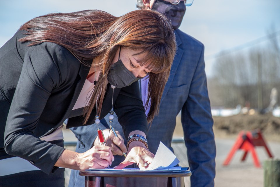 Lheidli T'enneh chief Dolleen Logan signs the Oath of Office at the swearing-in ceremony held Saturday on the Shelley reserve northeast of Prince George. Logan is the second female chief on the history of the Lheidli T'enneh people.