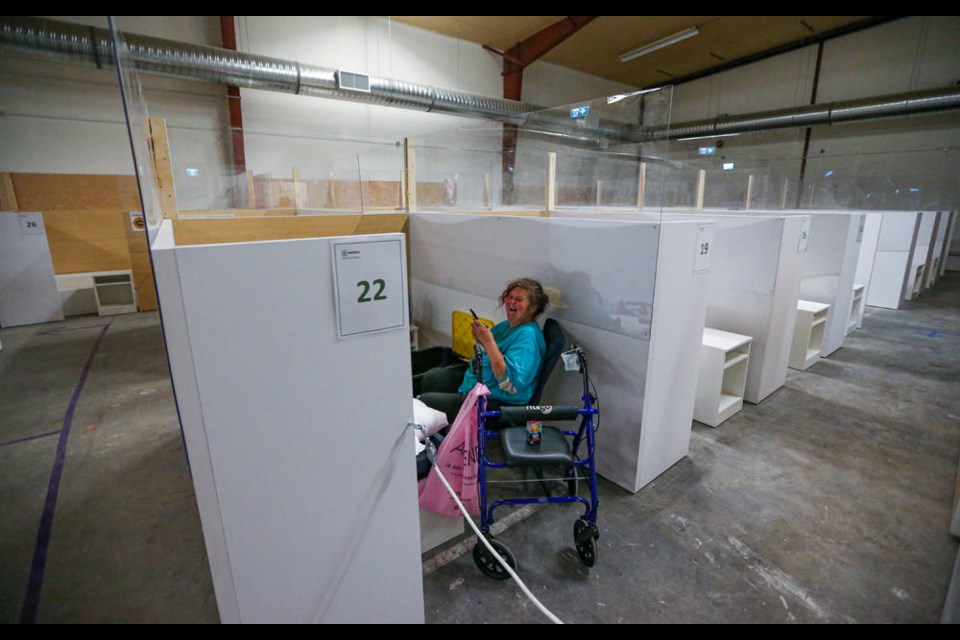 VICTORIA, B.C.: May 4, 2021  Nancy relaxes in her own little space, as Cathy Mingo and Grant McKenzie give us a tour of the shelter on Russell Street in VICTORIA, B.C. May 4, 2021. (ADRIAN LAM, TIMES COLONIST)