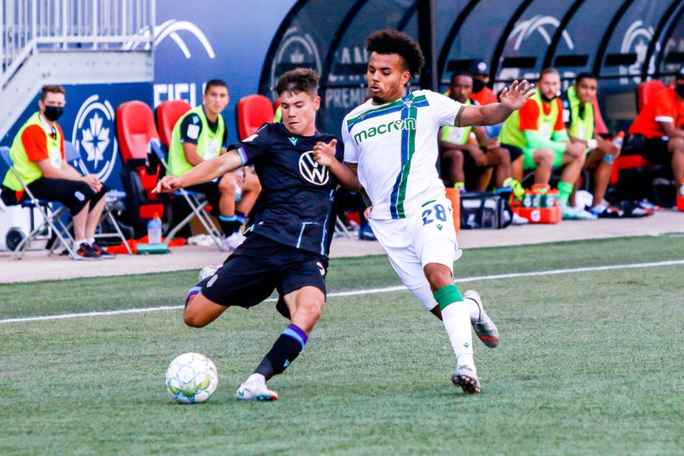 TC_281014_web_July-1-2021.-York-United-FC-vs.-Pacific-FC.-Second-Half.-Kadin-Chung-plays-the-ball-against-Cedric-Toussaint..jpg