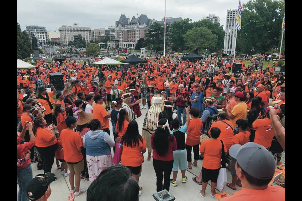 People gather at the legislature on Thursday, July 1, 2021, to remember Indigenous children who died while attending residential schools. TIMES COLONIST