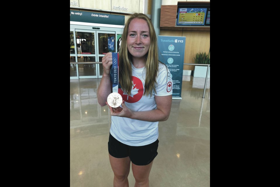 Rower Caileigh Filmer arrives at Victoria International Airport on Friday with her Olympic bronze medal from the Tokyo Olympics in the women’s pair with Hillary Janssens of Cloverdale. TIMES COLONIST. July 30, 2021