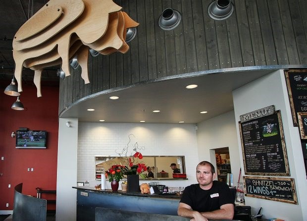 Jeff Hetherington, the owner of Pig, stands inside his restaurant at the Atrium Building.