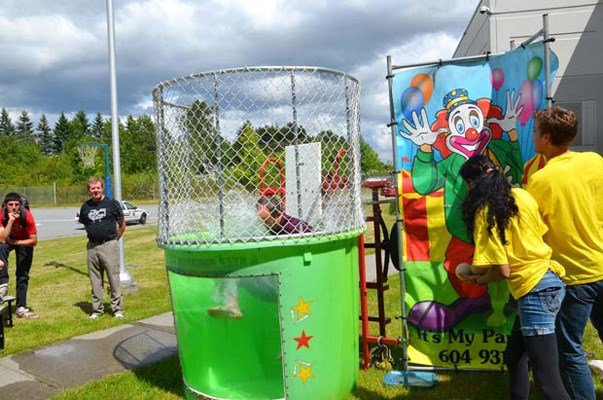 Byrne Creek Secondary had a fun fair to reward the students. Teacher Mr. Newman got wet in the dunk tank.