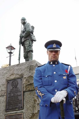 New Westminster Police Service Det. Charles Fortier pays his respects during the Nov. 11 Remembrance Day ceremonies in New Westminster.