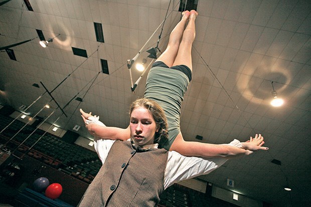 New heights: Christine Konrad holds Laura Evans in the air during rehearsal.