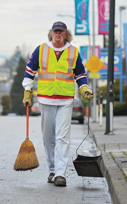 Tools of the trade: A broom and a dust pan were among the tools that Gord Gibson used as a beat man charged with keeping the Sixth Street area clean.