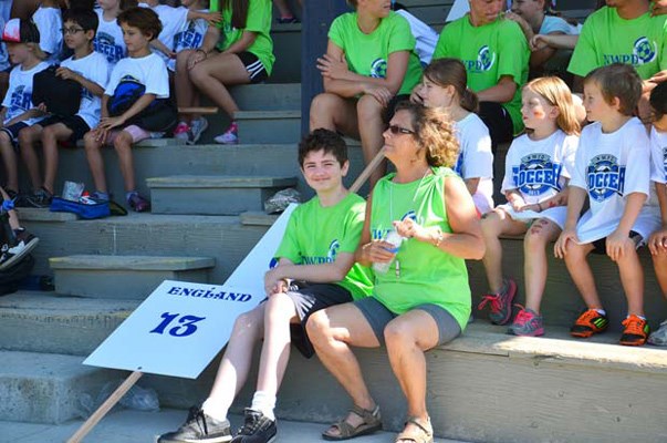 Checking it out: Kids watch a police demonstration at the New Westminster Police Department's soccer camp on July 23.