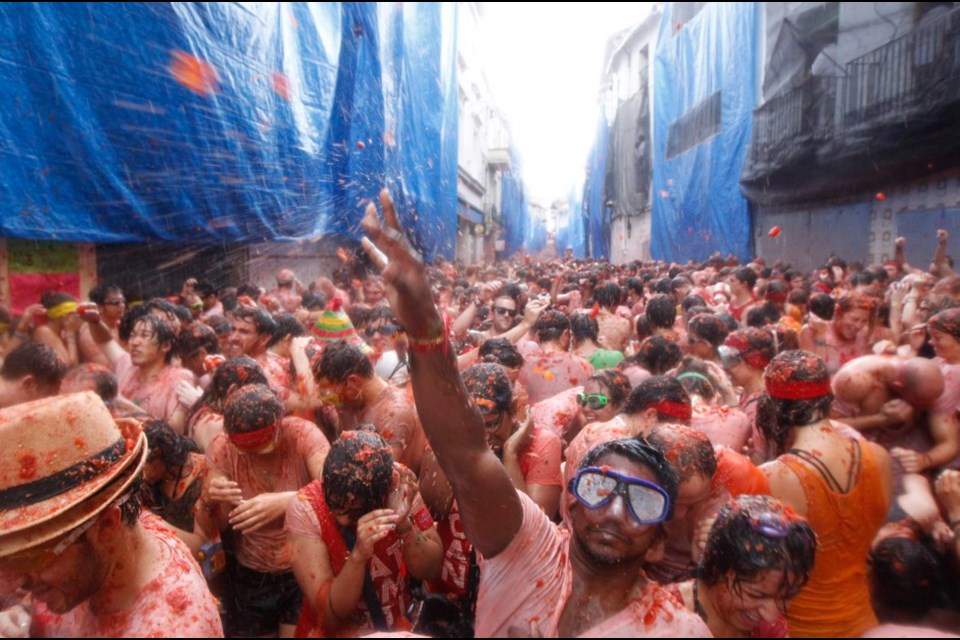 Crowds throw tomatoes at each other Wednesday during the annual Tomatina fight fiesta in the village of Bunol, 50 kilometres from Valencia, Spain.