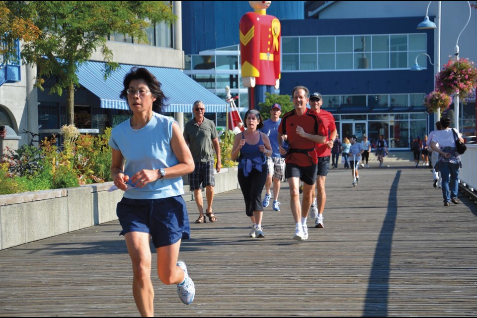 For Terry: Participants in last year’s Terry Fox Run run along the riverside boardwalk. This year’s run, which happens this Sunday, is again being held at the Quay.