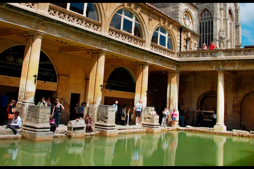 The Great Bath, fed with hot spring water, was perfect for a luxurious swim in Roman times (notice Bath's abbey in the distance).