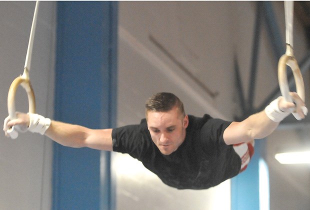 North Vancouver's Scott Morgan shows off his strength on the rings during a recent training session at Flicka Gymnastics Club. Morgan will muscle up in the World Artistic Gymnastics Championships starting Sept. 30 in Antwerp.