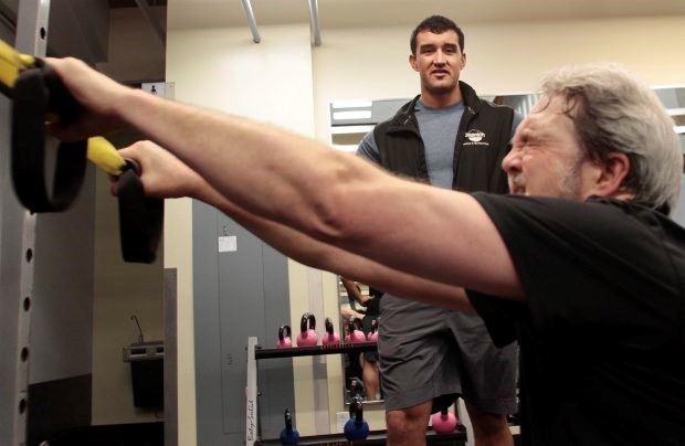 Health Club challenger Kevin Dean and trainer James Puckett. (Feb. 2012)