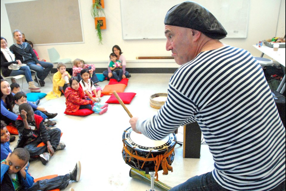 Musical pets: Boris Sichon entertains at River Market for Culture Days.