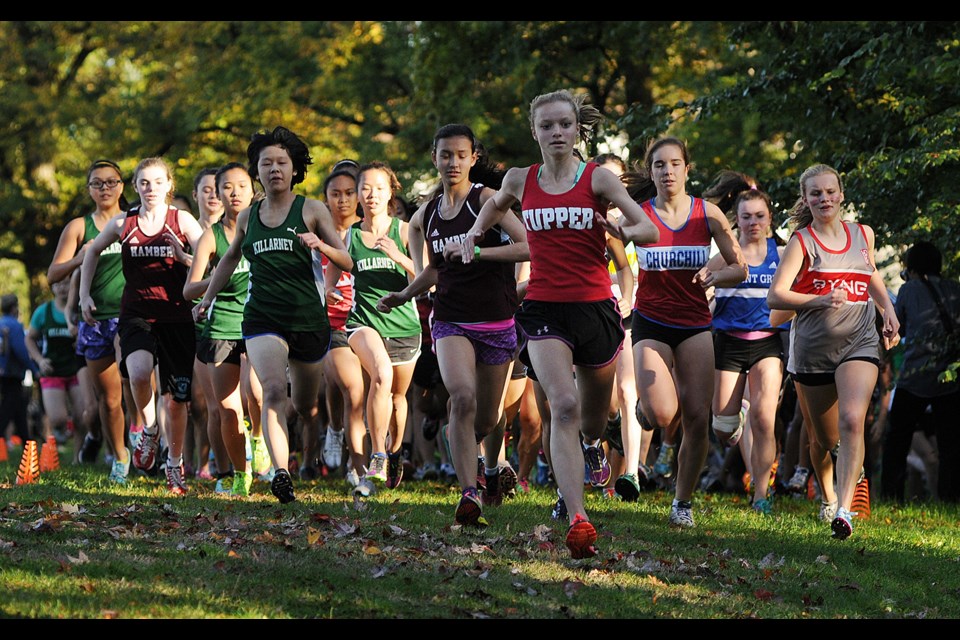 Girls take off from the start line of the 鶹ýӳcross-country final Oct. 23 at Fraserview Park. The winner, Callie Charlton, is on the right edge of the pack in a Lord Byng jersey.