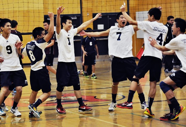 The David Thompson Trojans celebrate winning the senior boys city championship Nov. 1 at Magee secondary.