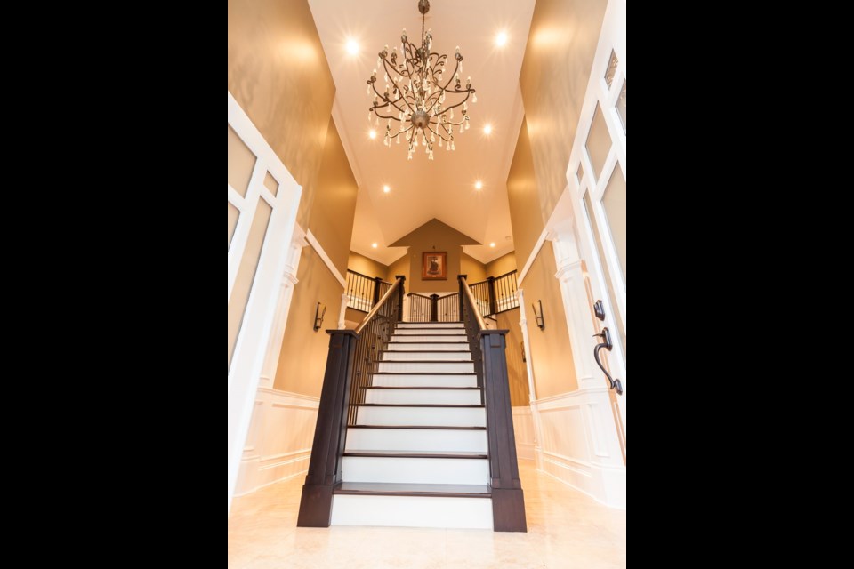 This Y-shaped, custom-designed staircase was constructed in a work shop and had to be lifted with a crane into the house, where it is now the home's centrepiece.