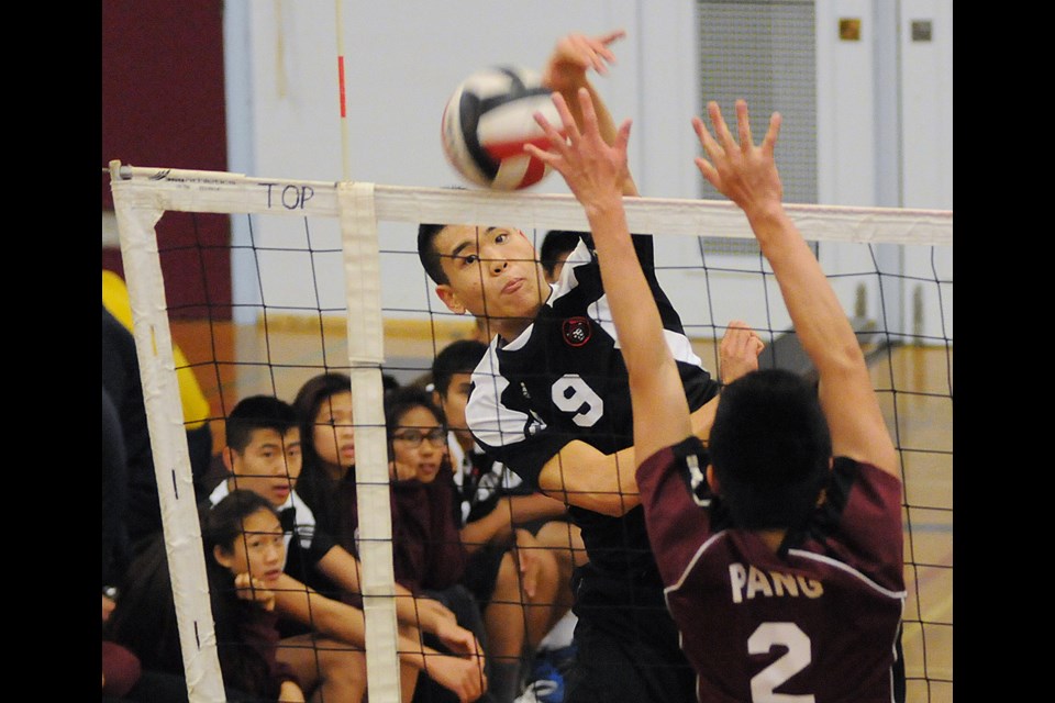 Gladstone's Allen Wong (No. 9) and Hamber's J. Pang (No. 2) compete in the senior boys Lower Mainland championship at Eric Hamber Nov. 13.