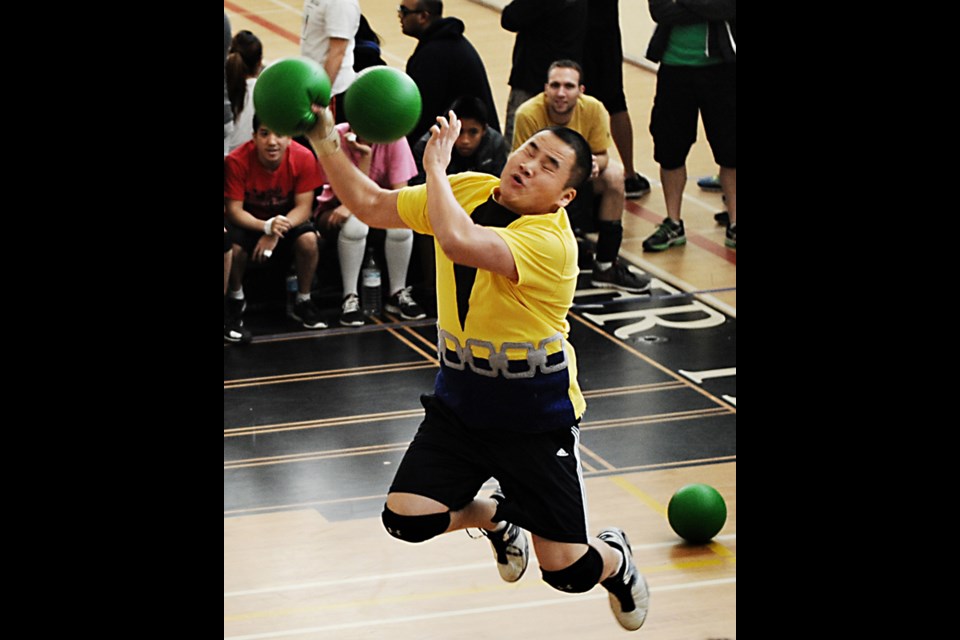 Shawn Chow gets nailed in the face in a game with his Avengers 2.0 team during the 鶹ýӳDodgeball League championships Dec. 7 at Van Tech secondary.