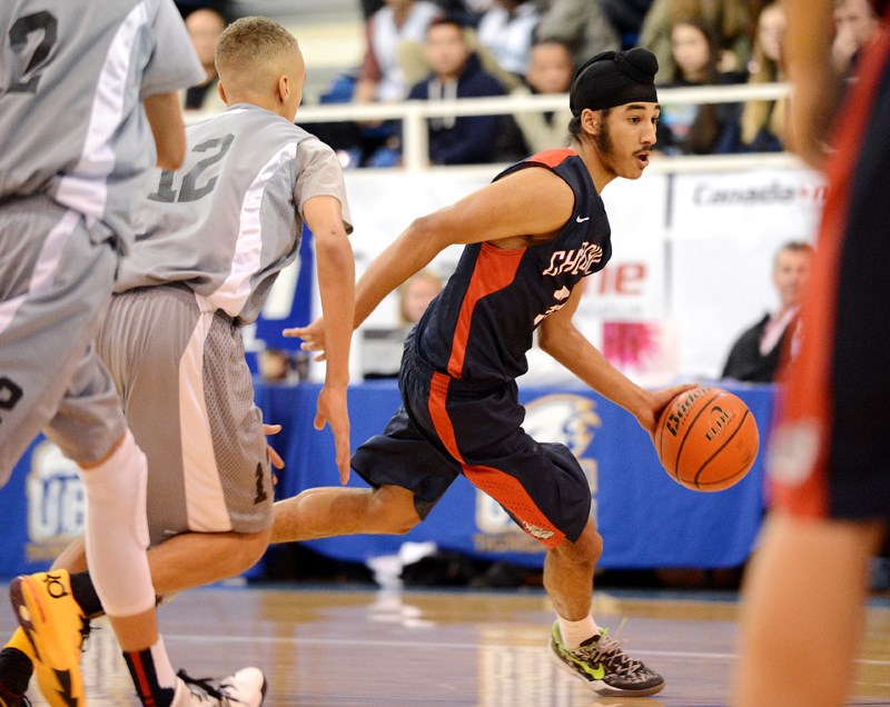 Gary Minhas (No. 30) dribbles into space during the Telus Classic Dec. 7 at UBC.