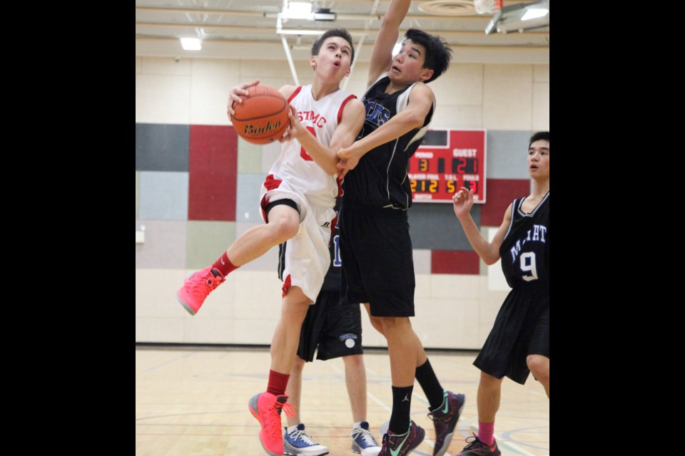 01-02-2014 STMC (white) vs. McMath, junior varsity high school basketball. photo Jason Lang