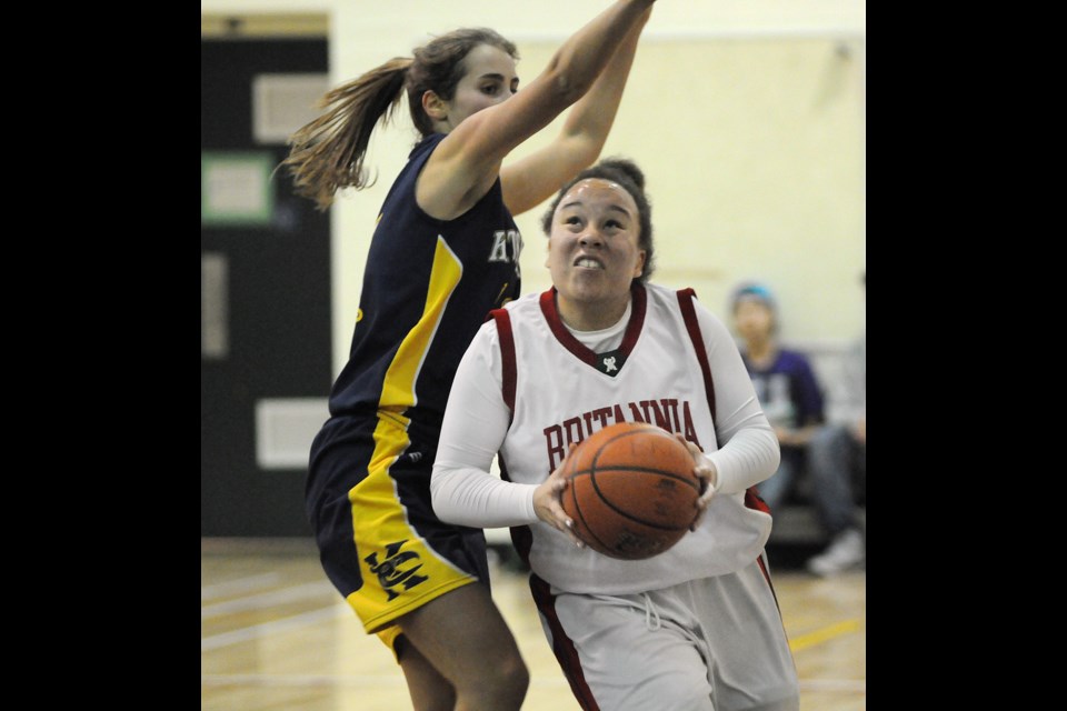 Bruin Amanda Young (No. 25) cuts to the hoop past Kitsilano’s Chiara Bostock (No. 11) at Britannia Jan. 7. The Bruins won 76-65.