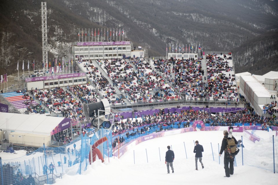 Sochi, Russia. 12th February 2014. A Spectator wears a drinking