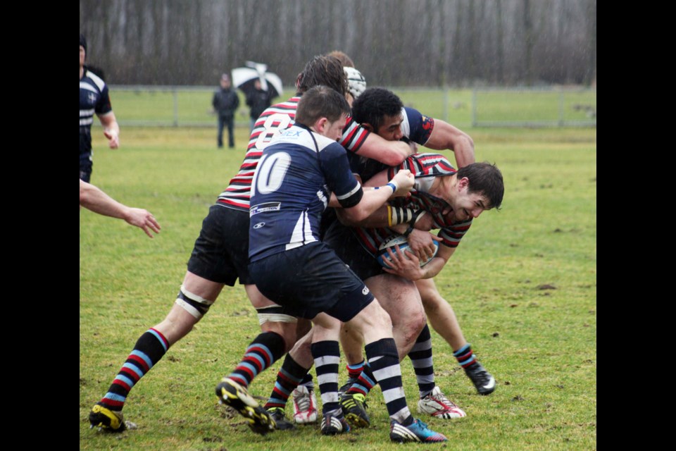 03-08-2014
Burnaby Lake (blue) against Castaway Wanderers, premier mens rugby at Burnaby Lake.
photo Jason Lang