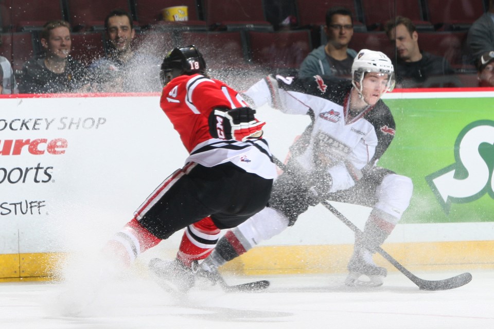 Carter Popoff throws up a spray of ice as he makes a pass. He scored Vancouver’s lone goal in a 6-1 loss to the Portland Winterhawks at Pacific Coliseum on March 26.