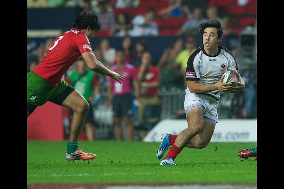 Sean Duke evaded a tackle in a 35-7 win over Portugal in the seventh stage of the rugby sevens series in Hong Kong on March 28.