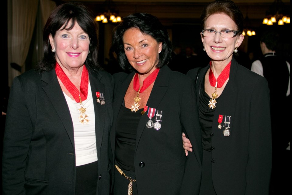 Leslee Farrell, left, and Gail MacKay flank Deedrie Ballard, the commander of the Victoria group.