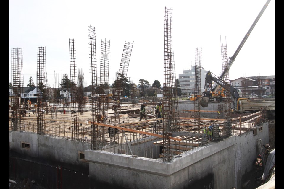 Monday: Iron workers prepare rebar for concrete at a $37-million care home under construction at Mount View in Saanich.