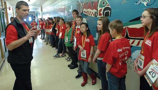 Alan Ramsay from The Prince George Citizen goes over last minute details with the spellers. Citizen photo by Brent Braaten   March 3 2012