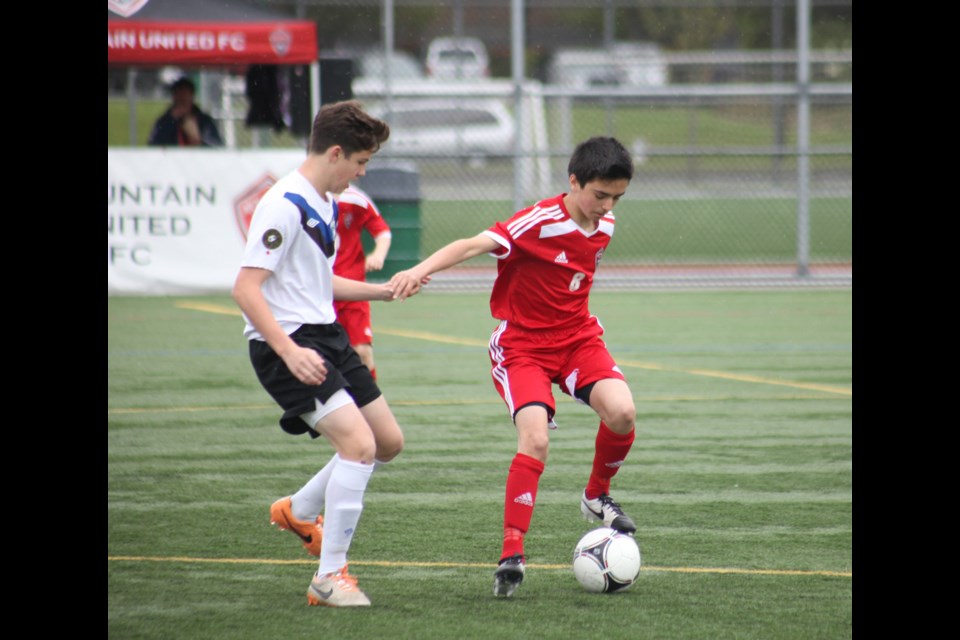 05-03-2014
Mountain United FC (red) against Vancouver Island Wave. u14 premier boys soccer.
photo Jason Lang