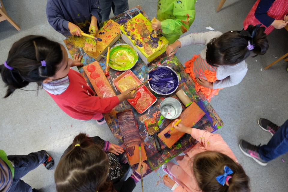 Students gather to create art at Advantage Preschool.