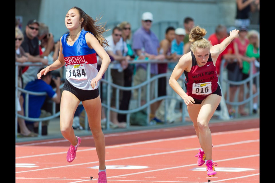 Churchill heptathlete Stephanie Cho set a B.C. School Sports record and won the 400 meter hurdles over Monique Lisek from Maple Ridge secondary at the B.C. championship in Langley on May 31, 2014.